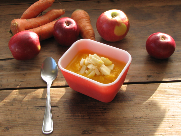 Carrot Ginger Apple Soup in Red Bowl